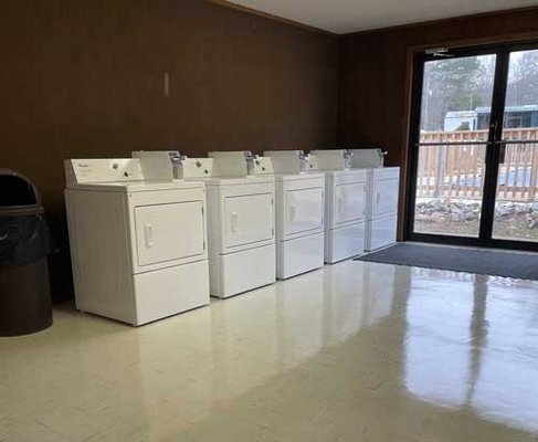 Bathrooms & Laundromat - At Mill Pond Village RV Park, the laundromat is equipped with washers and dryers. Campers will find it convenient to know there is a suitable building to do their laundry. Our machines are sanitized and maintained daily, so guests can be comfortable knowing that, whether it’s a short or long stay, they will have no issues with dirty laundry piling up. The cost to wash and dry your laundry is $2.00 for each machine, and the washers and dryers only take quarters.