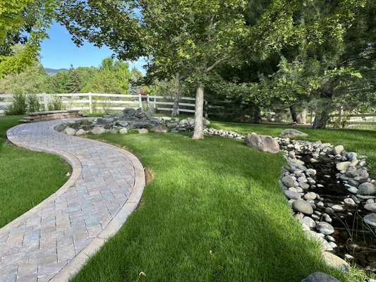 Waterfall - Customer had a waterfall that was not working for a couple of years. We removed the waterfall and creek. We re-installed the waterfall and new creek. Owner then wanted us to install patio to enjoy it.