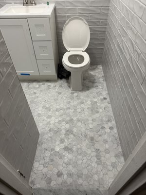 Bathroom - Full bathroom remodel including subway tile shower, marble mosaic flooring, custom shelving, and modern fixture installation. Licensed & insured NYC contractor.