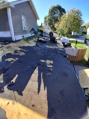 Complete roof tear off and new modified rubber roof system - This particular customer was having a lot of issues with his old shingle roof system obviously the pitch of the roof was not steep enough for shingles.So we added a new modified torchdown rubber roof system , commercial grade