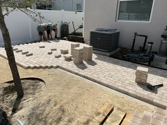 Patio around pool area - This was a patio paver project around the customers in ground pool. Railroad ties were used as a border which gave it a unique look.