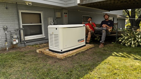While home Generac generator - My two fabulous technicians, Julian, Logan, sitting by the brand new installation for a customer in Richfield. Just knowing that this customer will be protected when the utility drops out.