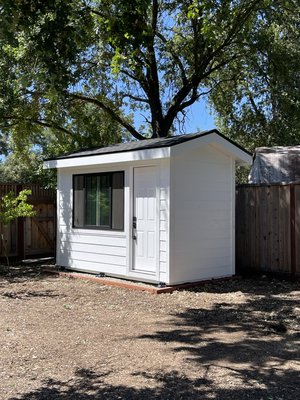 Modern Craftsman Shed - I’m a carpenter/builder and custom design these types of structures and this one is BRAND NEW just built with a “Craftsman / Modern Style” 
She Shed or future Home Office or storage.

The Total NEW COST with the following options would be at $8,500

Are you looking for more space on your property? Need a home office detached from your house? 

Unit Measures:
7ft Wide by 12ft in Length and Residential 8ft Tall Walls

It is perfect for a home office, an art or photo studio, home gym, a playroom for the kids, or anything else you can think of doing with extra storage space for a backyard shed.

This is custom made with high quality craftsmanship and materials including the following features:
- Hardie Fiber Cement Lap Siding & Trim (fireproof, termite proof, woodpecker proof) ($2,000 option)
- ANDERSON 6ft by 4ft dual pane dual slider window ($800 Option)
- Residential 8ft tall walls
- Gable Roof with Overhangs
- Upgraded subfloor 
- Residential Fire Rated front door which is Insulated and sealed
- Exterior rated Pressure treated 2x6 floor joist with an extra layer of waterproof coating
- All Galvanized Simpson structure hardware (joist hangers, rafter hangers, hurricane ties, etc) 
- Only Exterior rated galvanized screws and nails throughout 
- 25 Year Shingled Charcoal Roof with full ice and water shield barrier and high end synthetic felt with color matched drip edge

This is all brand new and includes the full white exterior paint for a full 3 year warranty on craftsmanship and water leaks.

I build these custom to size to order for customers from 6ft x 6ft all the up to 10ft x 12ft. Prices range from $5k for small shed up to $10k for large sizes and premium options.