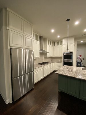 Factory Finish Kitchen Cabinets - This Client Added New Cabinetry and Wanted A Smooth Factory Finish On Her Entire Kitchen With A Fresher & Brighter Color . We Removed All The Doors and Sanded Them Down . Then Continued to Prime , Spackle , Sanded Again , Caulked and Did The Same Process for The Boxes . We Covered Everything In Sight Not Being Painted and Did What We Do Best 👨🏽‍🎨💪🏽.