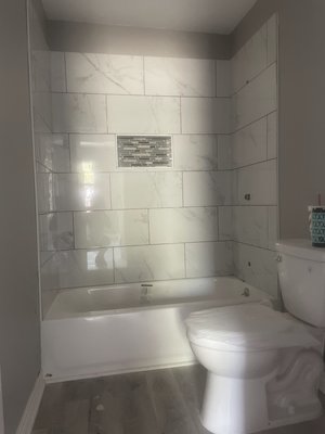 Bathroom remodel - This bathroom remodel was completely gutted out. Went in with new sheet rock paint plumbing tub tile walls and vinyl flooring.