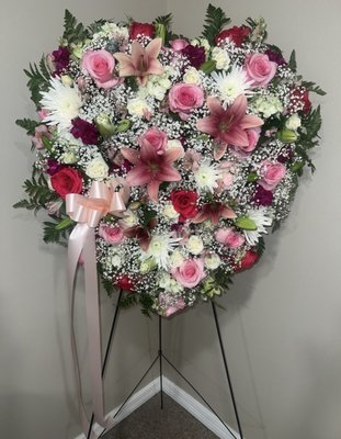 Funeral Photos - We make sympathy arrangements and personalized funeral arrangements with a variety of casket sprays, standing sprays and wreaths. Always thinking about the preferences of our customers.