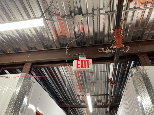 Commercial Lighting and Emergency Exit Sign Installation - Commercial services include relocation of lighting, signage, circuits and panels. This customer purchased an existing storage facility and we helped them modify the building layout to fit their needs.
