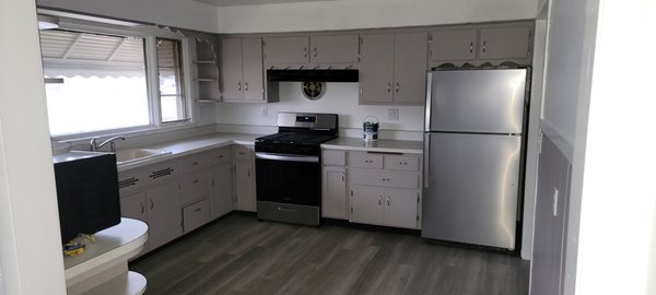 Kitchen renovation - This kitchen renovation was part of a whole house renovation. Needed new paint on cabinets, walls and ceiling. Also installed one new cabinet with new pull throughout. Alos installed new vynal flooring.