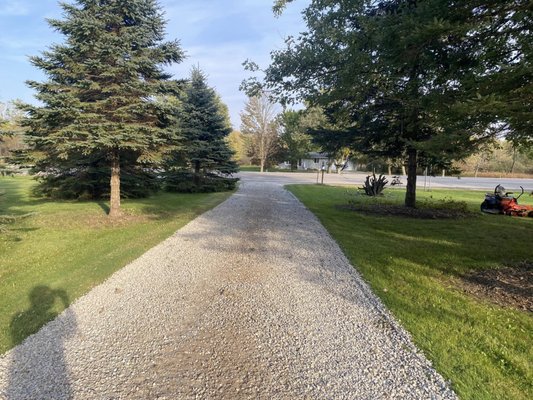 Driveway redone 2024 - This driveway needed a face lift. We added stone and spread it out nice and level over the driveway. Driveway redone 2024 - This driveway needed a face lift. We added stone and spread it out nice and level over the driveway.