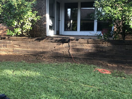 Railroad Tie Retaining Wall in Arlington - Customer's old retaining wall was collapsing and she hired us to build her a new one. Railroad Tie Retaining Wall in Arlington - Customer's old retaining wall was collapsing and she hired us to build her a new one.