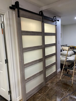 Sliding Barn Door installation - This was a clients food pantry before I installed sliding barn doors and I also installed electrical switch along with a lighting fixture so they could have a light in there food pantry. They were very pleased with the job.