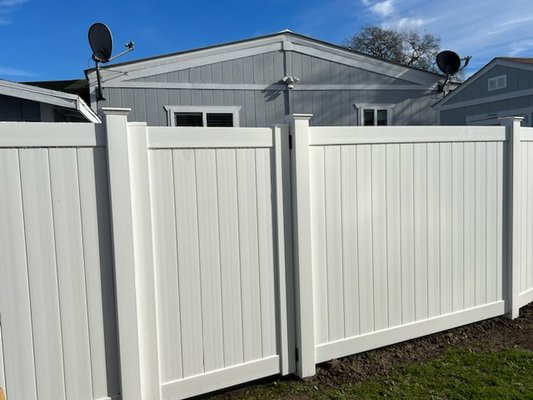 White solid privacy vinyl fence - Embracing a traditional approach, this design provides maximum privacy for your property. Generally, solid white privacy fences incorporate Tongue & Groove Boards and Posts. The tongue and groove pickets play a crucial role in eliminating any gaps within the fence, making it an ideal choice for containing animals or small children within your yard.