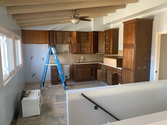 Kitchen Remodel - This is a Mid Sized Kitchen remodel. We took the flooring (wood floor with a little tile), cabinets and drywall, and opened the entire wall to the ceiling. Kitchen Remodel - This is a Mid Sized Kitchen remodel. We took the flooring (wood floor with a little tile), cabinets and drywall, and opened the entire wall to the ceiling.