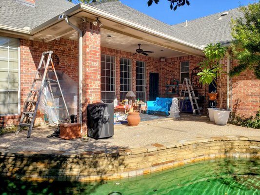 Patio by the Pool - This beautiful brick home had a classic look, but its exterior details were starting to blend in rather than stand out. The front entrance and patio trim were painted in a neutral tone, making the architectural features less prominent. The back patio, while functional, lacked vibrancy, with a plain ceiling and trim that didn’t add much character to the space. While the home had great bones, it was ready for a refresh to enhance its curb appeal and bring new life to both the front and back areas.