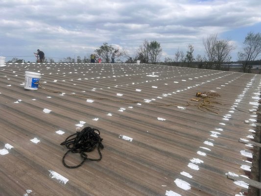 Metal Roof Coating Project - In this project, we helped a customer to identify the most economical way to address their roof concerns. We repaired several sections of the roof and then applied a coating to seal the roof. This help the customer to avoid the cost of installing a new metal roof. Metal Roof Coating Project - In this project, we helped a customer to identify the most economical way to address their roof concerns. We repaired several sections of the roof and then applied a coating to seal the roof. This help the customer to avoid the cost of installing a new metal roof.