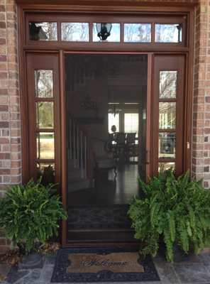 Retractable Door Screens - The Professional Series™ is the original retractable door screen by Phantom Screens® that uses a magnet latching system.  Whether you need to screen a double-French doorway from insects, add privacy to a living space, or shade a room from the direct glare of the sun, we have a disappearing screen solution that fits every screening challenge.
The innovative design and low profile of Professional Series™ Retractable Screen Doors make them compatible with most door types and finishes. Designed to address both home aesthetics and function, Professional door screens come in different colors and sizes, and tie in with virtually any existing design and décor.

Legacy by Phantom Screens is the only retractable door screen with an integrated Latch & Release handle making it easy to use, quiet to operate and secure from unintended openings. Legacy provides superior insect protection and enhanced natural ventilation for your home while maintaining your view and décor.
Legacy fits all door types including in-swing, out-swing, single, double and patio slider doors. Our wide range of color and finish choices allow Legacy to blend seamlessly with your doorways. Improve indoor air quality, enhance home functionality and reduce cooling costs – call your local distributor for an in-home consultation today!