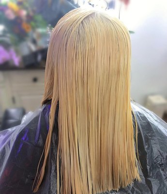 Color Transformation - My client Izzy previously had a global bleach out. When she came to me, she had blue toned all over her head with hair dye she bought from her local beauty supply. Due to the pandemic, Izzy had long quarantine roots. I went in and did a root touchup on her and tried to remove as much of the blue as possible. After stripping the blue, I went in and color corrected the unwanted green pigment that was stained on her hair. After 3 hours later, we achieved a pretty clean and blonde canvas. I gave her a one-lengthen trim, them color melted her hair using Pulp Riot colors!