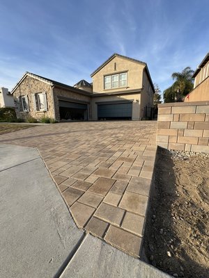 Driveway Repair - In just four days, we transformed an old concrete driveway into a stunning paver masterpiece. The project started with a full demo of the existing concrete, making way for a solid base. From there, we laid high-quality pavers in a sleek, eye-catching pattern that instantly elevated the home’s curb appeal. With precision cuts, smooth transitions, and a flawless finish, the result was a durable, elegant driveway built to last. Another job done right—fast, clean, and built to impress!