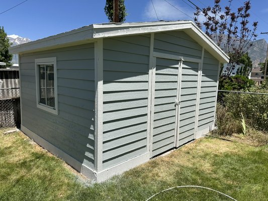Shed Exterior (June 2024) - This repaint was done in Orem. Lots of scraping and a lot of primer and caulk. Costumer was very satisfied with the result and we are sure that shed is going to look very good for at least another 10 to 15 years.