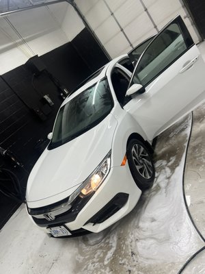 Honda civic in for pet stain removal + polish - This customer came in with her white Honda civic seeking advice on how she can get the pet stain removed from her cloth seats. We suggested our under boss package, we extracted all floor liners and seats and polished the entire exterior making sure it’s back to showroom shine and smell!