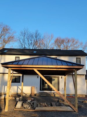Project: “Gazebo Roof Upgrade” – Clean Look, Solid Build - A new gazebo deserves a roof that makes a statement — and that's exactly what we delivered for this backyard build in New Jersey.
Our client wanted a solid, weatherproof cover that would protect their outdoor space year-round while complementing the home’s clean, modern style. We came in, assessed the framing, and got to work.
🔨 What We Did:
✔️ Prepped the gazebo framing for roofing
✔️ Installed a matte black standing seam metal roof — sleek, durable, low-maintenance
✔️ Secured all seams and edges to make sure this structure handles anything NJ weather throws at it
The end result is a beautiful, architectural-grade roof that elevates the whole backyard.
✅ Why It Works:
Long-lasting performance – metal beats shingles in durability and weather resistance
Low upkeep – no peeling, cracking, or replacing
Stylish design – bold lines, modern color, built to stand out
📸 Before & After:
Before: Raw framing with underlayment
After: Bold, clean black metal roof — ready for finishing touches and summer gatherings
⏱ This job took about 1 day, start to finish. Fast, clean, and built to last.
Thinking of building a gazebo, pergola, or porch cover?
We’ll help you finish it the right way — with a roof that protects, performs, and looks incredible. Project: “Gazebo Roof Upgrade” – Clean Look, Solid Build - A new gazebo deserves a roof that makes a statement — and that's exactly what we delivered for this backyard build in New Jersey.
Our client wanted a solid, weatherproof cover that would protect their outdoor space year-round while complementing the home’s clean, modern style. We came in, assessed the framing, and got to work.
🔨 What We Did:
✔️ Prepped the gazebo framing for roofing
✔️ Installed a matte black standing seam metal roof — sleek, durable, low-maintenance
✔️ Secured all seams and edges to make sure this structure handles anything NJ weather throws at it
The end result is a beautiful, architectural-grade roof that elevates the whole backyard.
✅ Why It Works:
Long-lasting performance – metal beats shingles in durability and weather resistance
Low upkeep – no peeling, cracking, or replacing
Stylish design – bold lines, modern color, built to stand out
📸 Before & After:
Before: Raw framing with underlayment
After: Bold, clean black metal roof — ready for finishing touches and summer gatherings
⏱ This job took about 1 day, start to finish. Fast, clean, and built to last.
Thinking of building a gazebo, pergola, or porch cover?
We’ll help you finish it the right way — with a roof that protects, performs, and looks incredible.