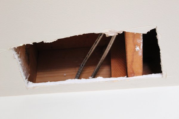 Wall Removal - "Wall removal project, inspection for determining if the wall is bearing or nonbearing was performed. The wall was gravity bearing wall and a new frame was designed to carry the gravity load to the ground"