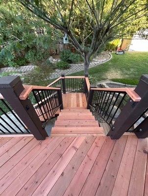 Custom redwood deck build and remodel - This is a custom redwood wrap around deck with stairs and railings Custom redwood deck build and remodel - This is a custom redwood wrap around deck with stairs and railings