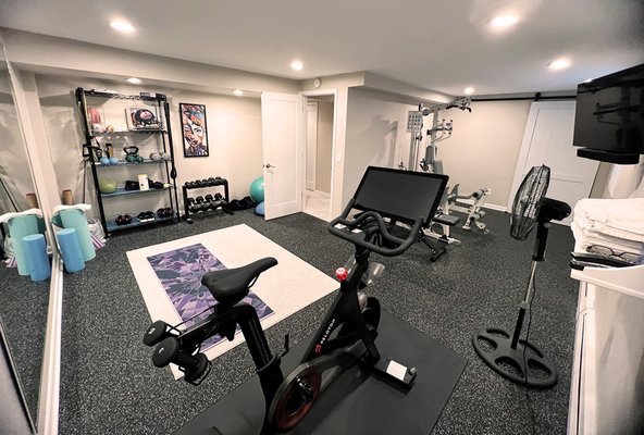 Home Gym - This home gym started out as two separate rooms in the basement a 1960s ranch and turned into a functional space that is used daily. Home Gym - This home gym started out as two separate rooms in the basement a 1960s ranch and turned into a functional space that is used daily.