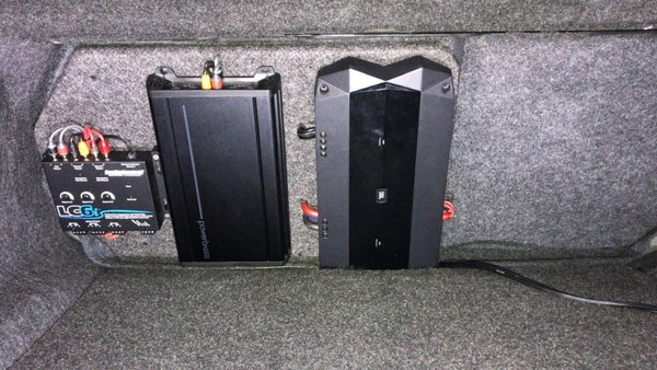 Custom Stealth Audio system - Custom audio system installed behind rear seats with no visible running cables. Custom Stealth Audio system - Custom audio system installed behind rear seats with no visible running cables.