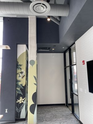 Black Matte Venetian Plaster - This Venetian plaster project was made in a new building, the architect wanted a black matte finish in the lobby. They liked it so much we ended up doing it in the mail room, conference room and break room.
