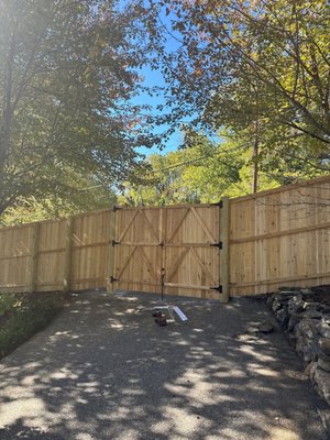 6' High Cedar Privacy Fence With Cap-Board - Completed installation of a 6' cedar privacy fence with cap and board, plus an 8' wide x 6' high double drive gate. Cedar offers natural beauty and long-term durability, making this a great choice for residential fencing, privacy, and security.