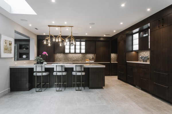 Cabinetry by Christiana - Beautiful contemporary cabinets featuring custom cabinetry sabarno with dark brown stain. Cabinetry by Christiana - Beautiful contemporary cabinets featuring custom cabinetry sabarno with dark brown stain.