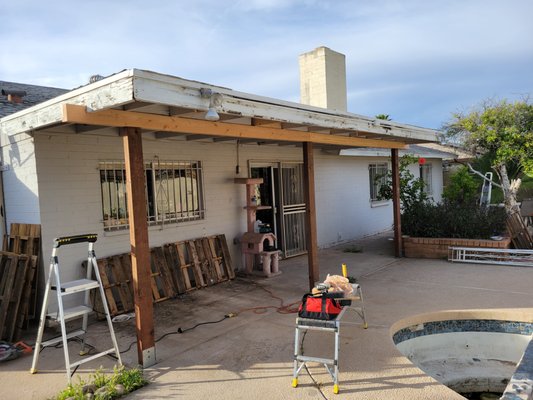 Patio pillars/support beams replaced - The support metal pillars for back patio were rotten, they were barely holding up the patio roof and also the support beam was badly bowed. So we removed and installed new support beams and new beams for the pillars then mounted securely to ground.