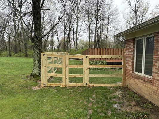 Milford fence job, Kentucky split 4 rail - Kentucky 4 rail style fence with metal fencing to keep dogs in the yard.
