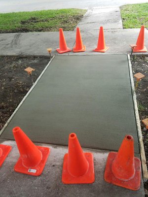 Concrete sidewalk slab prep, pour and finish work - Concrete side walk trip hazard repairs! Preparation of the work area, concrete pour and finish work for over 1,000 LNFT of sidewalk
