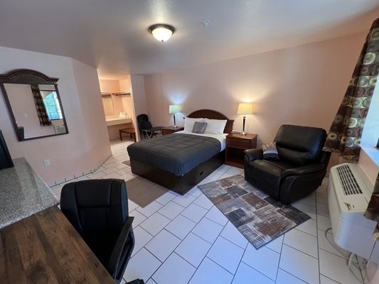 Handicap Accessible Queen Suite - Roomy 276 square foot Queen room with all Tile floors Built for wheelchair bathroom access, High speed WIFI for work and streaming, Work desk and office chair, Roku or mirror your cell phone to TV screen, mini fridge, microwave, soft chair, hair dryer, Dresser with granite top, nightstands. Handicap Accessible Queen Suite - Roomy 276 square foot Queen room with all Tile floors Built for wheelchair bathroom access, High speed WIFI for work and streaming, Work desk and office chair, Roku or mirror your cell phone to TV screen, mini fridge, microwave, soft chair, hair dryer, Dresser with granite top, nightstands.