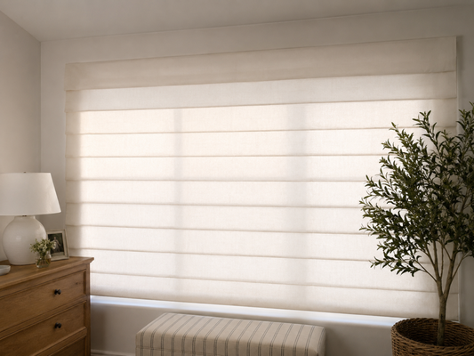 Roman Shade - Here's a polished description that's approximately 1,000 characters and optimized for a website, Yelp post, portfolio, or social media showcase:

This elegant bedroom transformation features custom white Roman shades installed on a large sliding glass door, creating the perfect balance of privacy, light control, and timeless style. The clean, tailored folds of the Roman shade add softness and sophistication to the room while complementing the existing décor with a bright, modern look.

For this project, the homeowner wanted to maintain natural daylight without sacrificing privacy. We selected a premium light-filtering fabric that gently diffuses sunlight throughout the space, reducing glare while creating a warm and inviting atmosphere. During the day, the shade allows soft natural light to enter the room while limiting visibility from the outside, making it an ideal solution for bedrooms and other private living spaces.

The custom Roman shade was carefully measured and professionally installed to ensure smooth operation across the sliding door. Its sleek design provides a clean appearance when lowered and stacks neatly when raised, preserving outdoor views. This project showcases how custom Roman shades can combine functionality, privacy, and elegant design to enhance any bedroom while delivering lasting comfort and style.