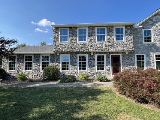 Stone veneer work - On this recent stone Venner project. I removed the siding from the house to prepare for the exterior stone. After assessing the structure, I applied the stone veneer, skillfully making sure every stone was placed right for a long last durability.