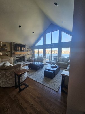 Apple Valley Lakefront - This interior painting project involved a complete transformation of a dated living area, utilizing a soft, neutral color palette to create a modern and welcoming ambiance. The walls were meticulously prepared with thorough surface cleaning and patching, followed by the application of a high-quality paint . A crisp, off-white shade was carefully chosen