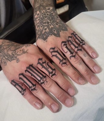 Lettering Tattoos - Custom lettering is not just any tattoo containing lettering. Custom lettering is a style of tattooing that focuses on creating unique and personalized fonts. They can vary from having a flowy script feel to a more bold and gothic style.