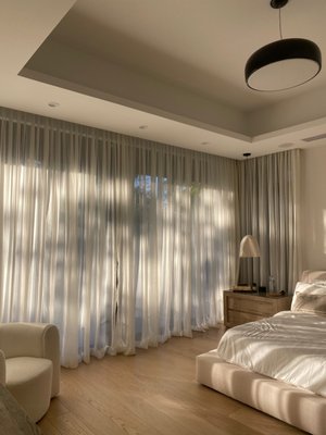 Sheer Drapery in Master Bedroom - South Miami - This new build in South Miami installed custom sheer drapery in the master bedroom for optimal light filtering and glare reduction. By adding motorization, the owner can control the drapery with a click of a button.
Love the look? Request a quote today for custom drapery in your home. Sheer Drapery in Master Bedroom - South Miami - This new build in South Miami installed custom sheer drapery in the master bedroom for optimal light filtering and glare reduction. By adding motorization, the owner can control the drapery with a click of a button.
Love the look? Request a quote today for custom drapery in your home.