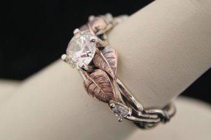 Custom Diamond Ring Jewelry - This custom design was created using yellow gold for the leafs, white gold for the vines, and a beautiful diamond to top it off.