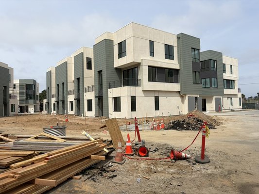 Exterior commercial sidding. Also full interiors - Brand new commercial project here in Serra mesa. Town homes. Painted exterior siding green, black rails , metal around all roof and by windows to match stucco color. And the black accent color around some windows Exterior commercial sidding. Also full interiors - Brand new commercial project here in Serra mesa. Town homes. Painted exterior siding green, black rails , metal around all roof and by windows to match stucco color. And the black accent color around some windows