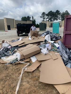 Commercial Business Cleanup - Client contacted All-in Hauling to clean up their dumpsters on site, that had been overflown by all the cardboard boxes and pallets from all the inventory they had just received. We went out there got it loaded in our dump trailer and hauled off.