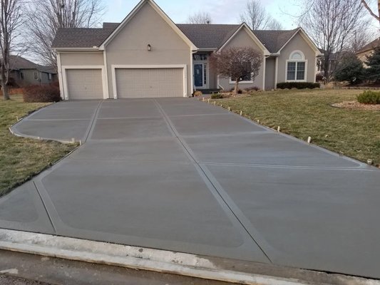Driveway Installation - Whether you need a new installation, a complete tear out and replacement, or decorative finishes, our skilled team ensures precision and quality in every project. With over 60 years of combined experience, we deliver exceptional driveways that withstand the test of time, offering both aesthetic value and reliable performance. Trust us to create a concrete driveway that meets your needs and exceeds your expectations.