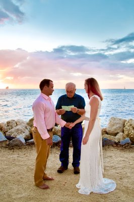 Perfect Sunset Wedding - This was a small wedding that took place at a prominent Key West beach, Ft. Zachary Taylor. It took place during the winter when out sunsets were more orange, but the photos couldn't have been captured at a more optimal time. The sunset was perfect.