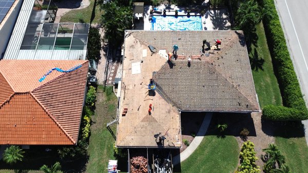 Cape Coral Re-Roof: Clay Tile to Standing Seam Metal - Here’s a behind-the-scenes look at a re-roof in Cape Coral, where we’re replacing an aging clay tile system with a 24-gauge snap-lock standing seam metal roof in medium bronze.
This project features:
✔️ Full tile tear-off and debris removal
✔️ Self-adhered underlayment for superior waterproofing
✔️ Premium standing seam panels (installation in progress)
✔️ Code-compliant build for Southwest Florida wind zones
Metal roofing offers lasting protection, modern curb appeal, and better energy efficiency—perfect for Florida’s climate. Cape Coral Re-Roof: Clay Tile to Standing Seam Metal - Here’s a behind-the-scenes look at a re-roof in Cape Coral, where we’re replacing an aging clay tile system with a 24-gauge snap-lock standing seam metal roof in medium bronze.
This project features:
✔️ Full tile tear-off and debris removal
✔️ Self-adhered underlayment for superior waterproofing
✔️ Premium standing seam panels (installation in progress)
✔️ Code-compliant build for Southwest Florida wind zones
Metal roofing offers lasting protection, modern curb appeal, and better energy efficiency—perfect for Florida’s climate.