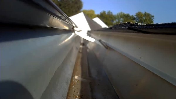 Gutter Cleaning Services - Single story house gutter heavily clogged. Before we cleaned the gutter and downspouts for free flowing drain water.