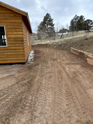 Driveway Widening and Retaining Wall - This beautiful cabin in Lake George needed a wider driveway to be able to put a boat! We widened the driveway, graded it out, and then laid down roadbase. We also built a retaining wall! Driveway Widening and Retaining Wall - This beautiful cabin in Lake George needed a wider driveway to be able to put a boat! We widened the driveway, graded it out, and then laid down roadbase. We also built a retaining wall!
