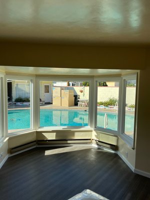 Bay window replacement in Anaheim - Bay window.The original was single pane plate glass that made the room look like a old fish bowl. Now we installed new Milgard Tuscany series white vinyl windows in a bay window style with new interior wood trim. Fantastic job well done! Bay window replacement in Anaheim - Bay window.The original was single pane plate glass that made the room look like a old fish bowl. Now we installed new Milgard Tuscany series white vinyl windows in a bay window style with new interior wood trim. Fantastic job well done!